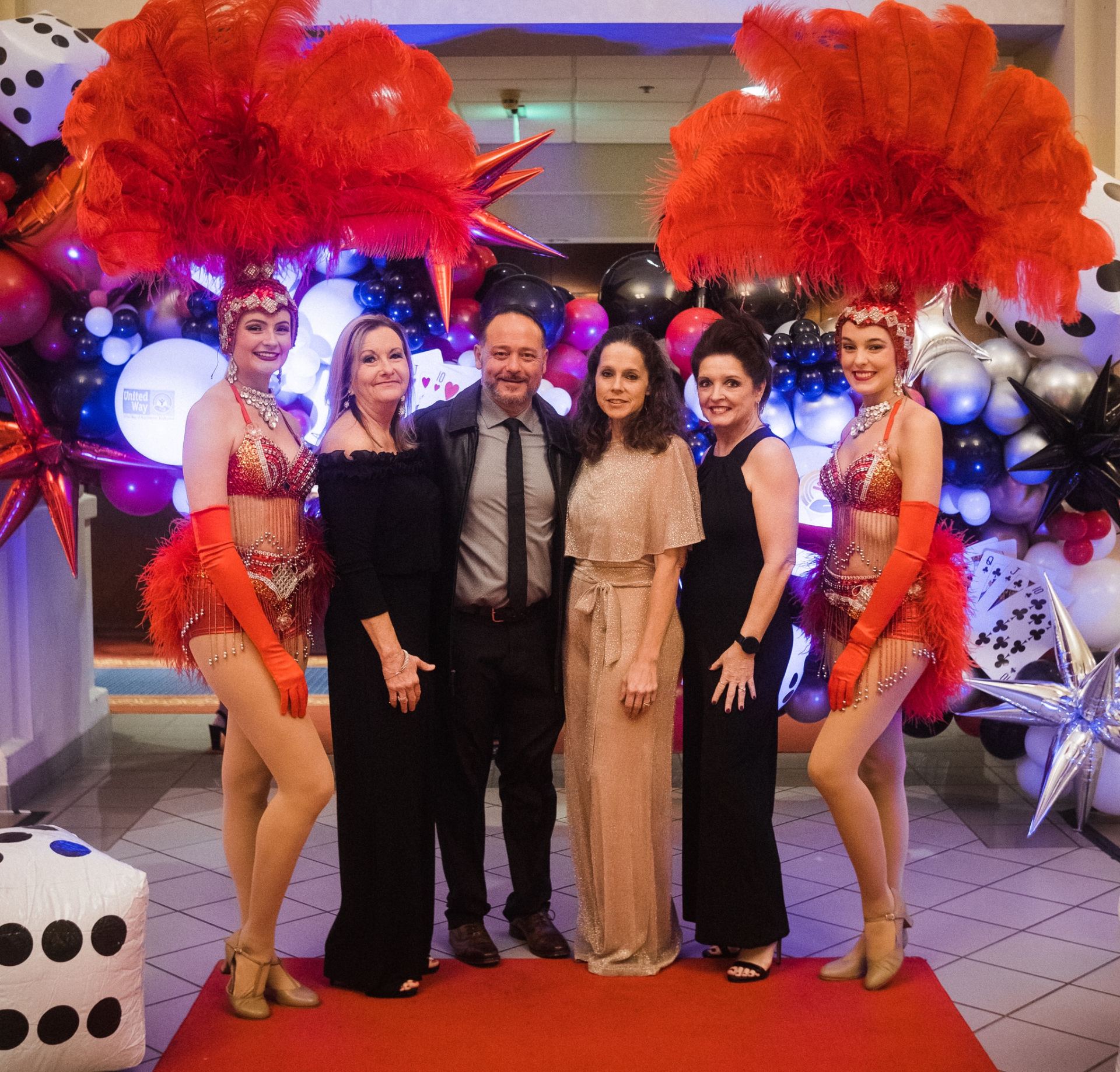 Casino Knight entertainers posing with guests at a corporate event