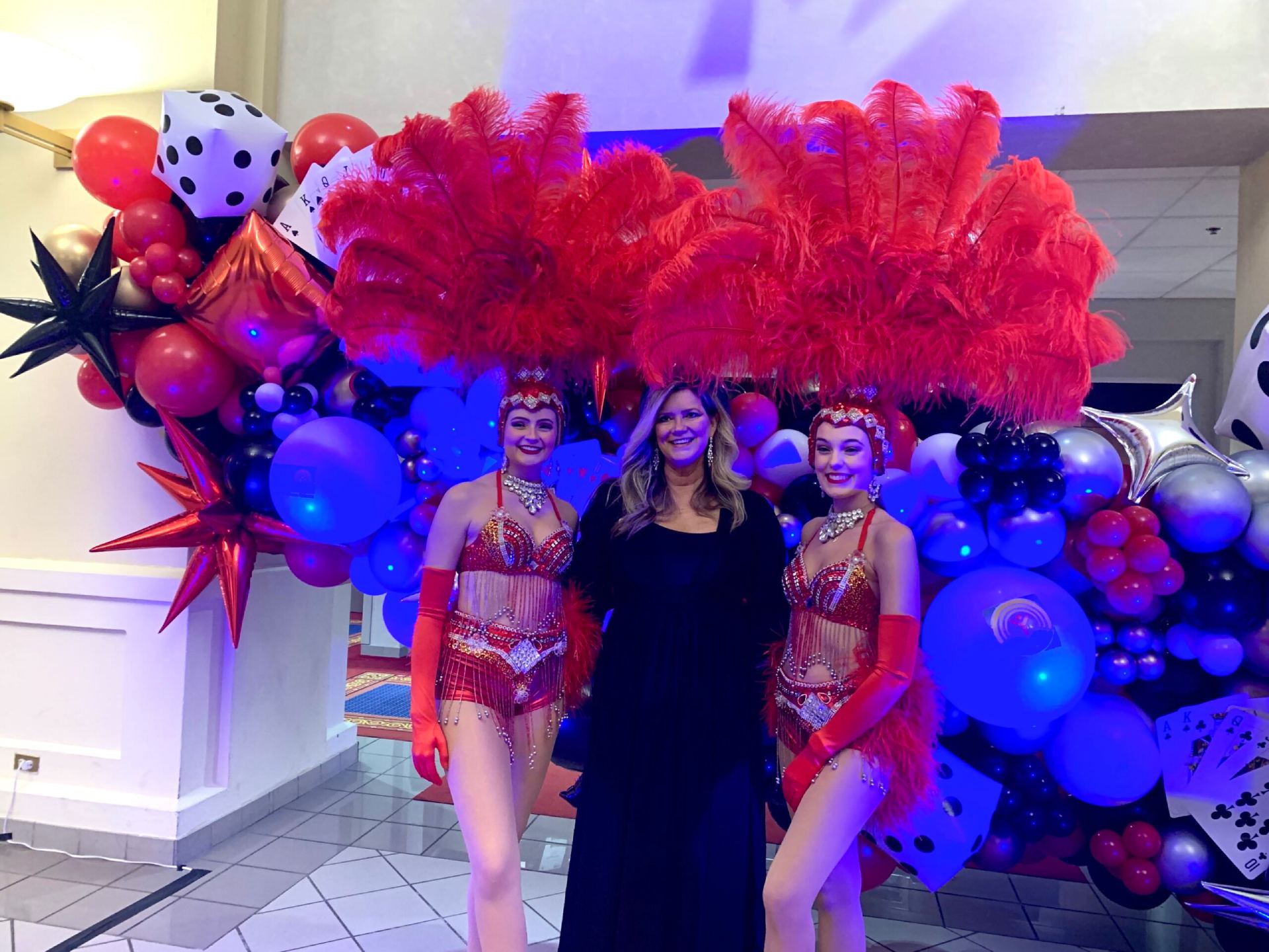 Casino Knight entertainers posing with guests at a corporate event