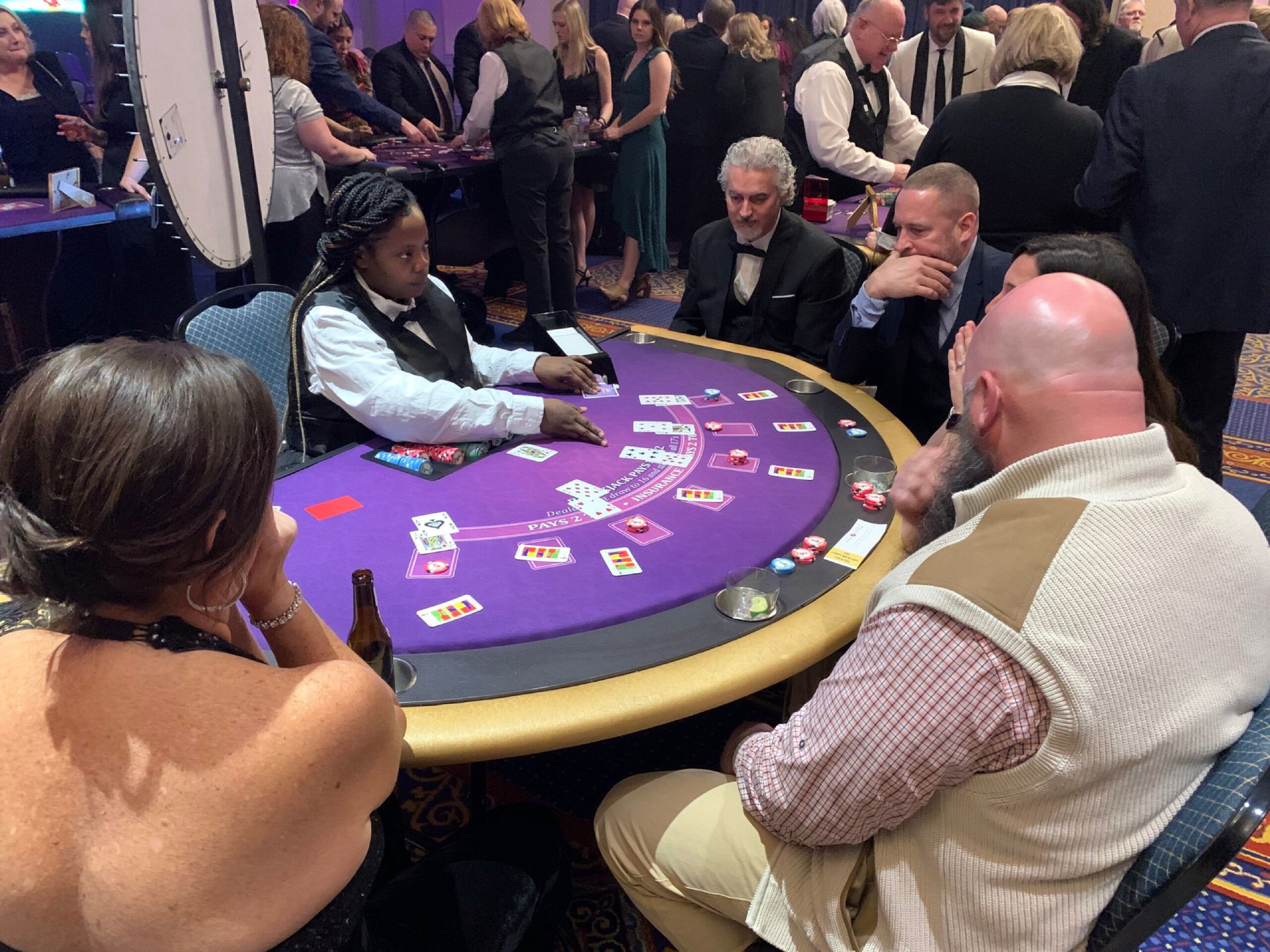 Guests playing blackjack at a Casino Knight casino party